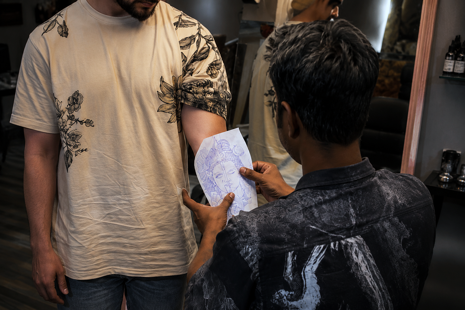 A tattoo artist at Inkspace Tattoo Studio in Hauz Khas, New Delhi, consults a client, illustrating how to choose the right tattoo placement.