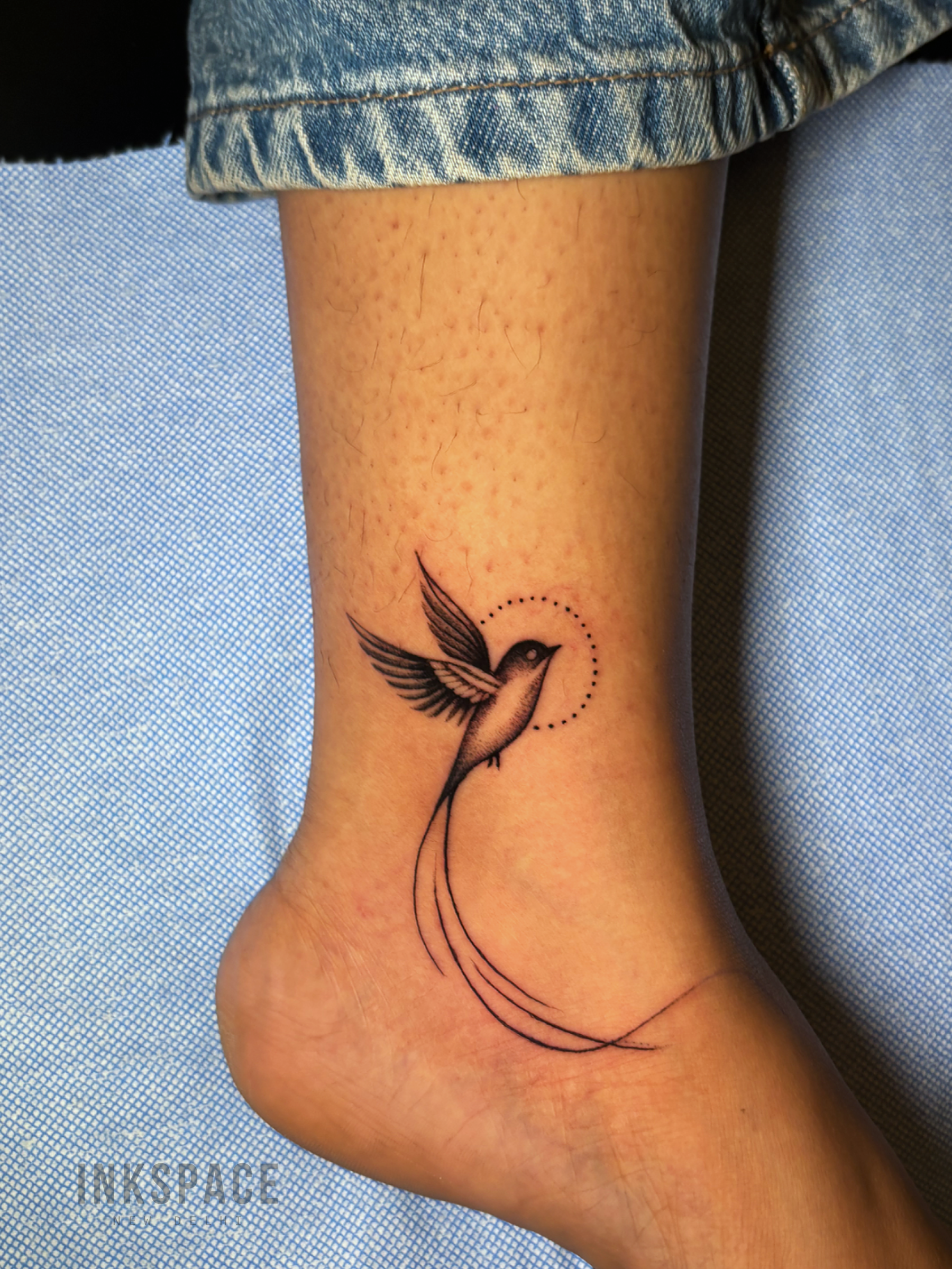 fine line tattoo depicting meaningful story elements