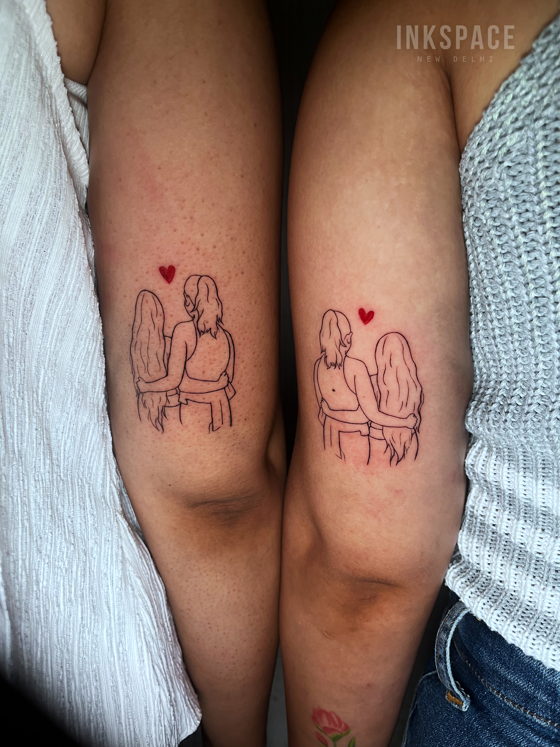 fine line matching sister tattoos