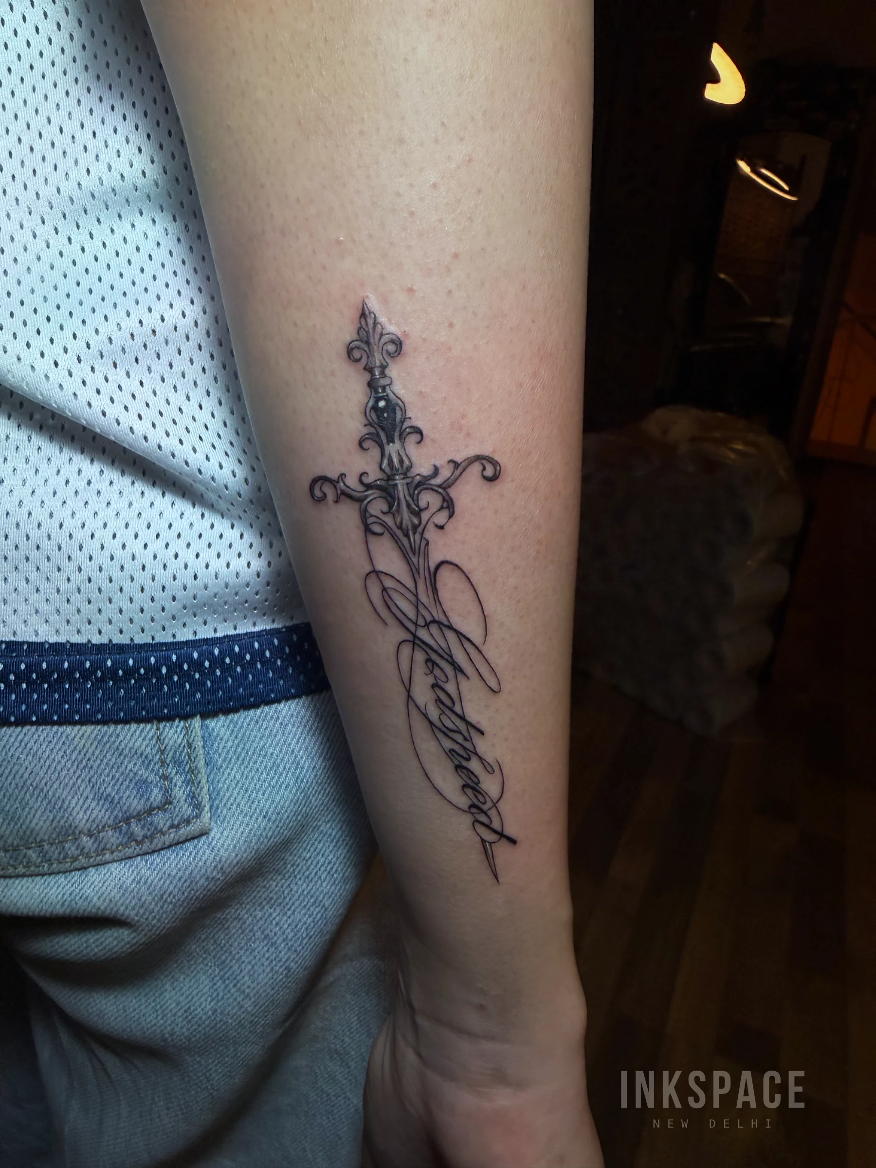 fine line ornamental sword tattoo design