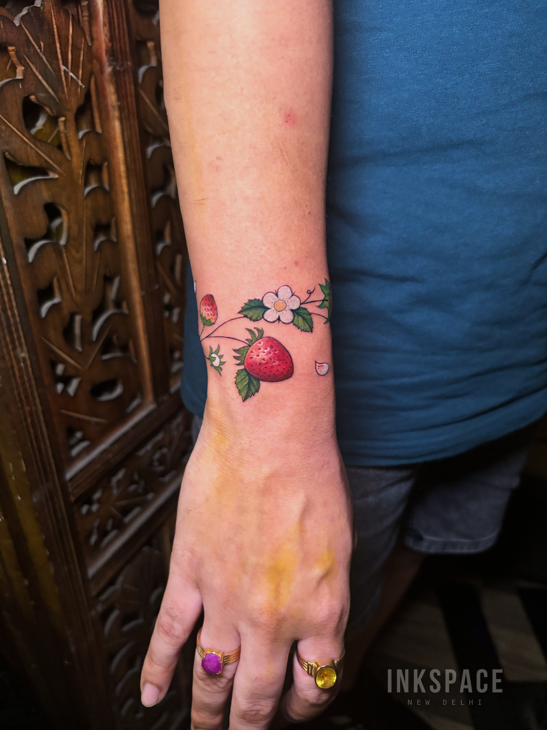 fine line strawberry botanical tattoo design