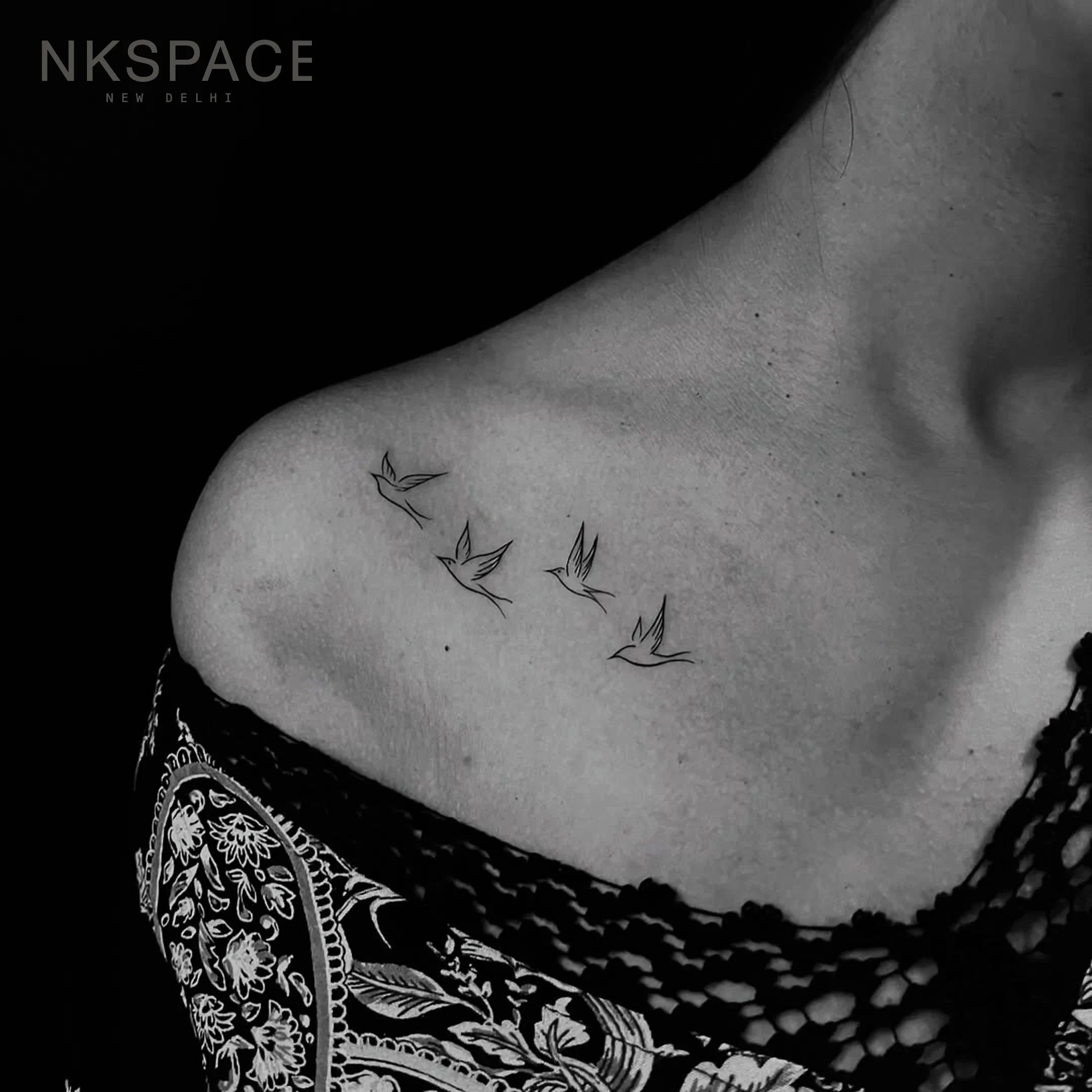 Fine line flying birds minimal outline tattoo on collarbone