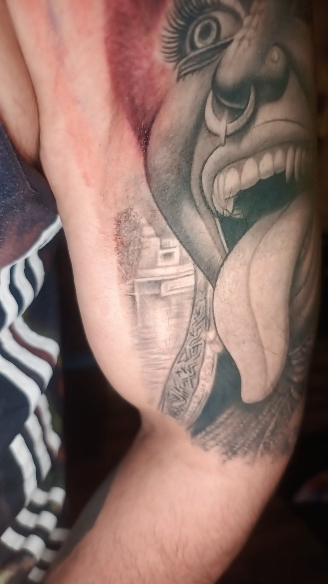 Healed realistic Kali tattoo on bicep by Chetan Salhotra