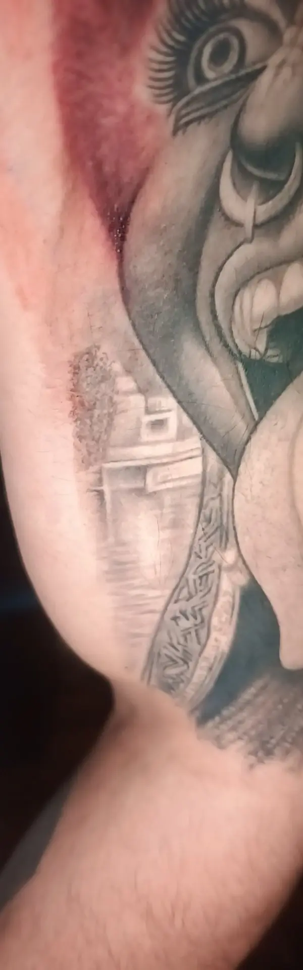 Healed realistic Kali tattoo on bicep by Chetan Salhotra