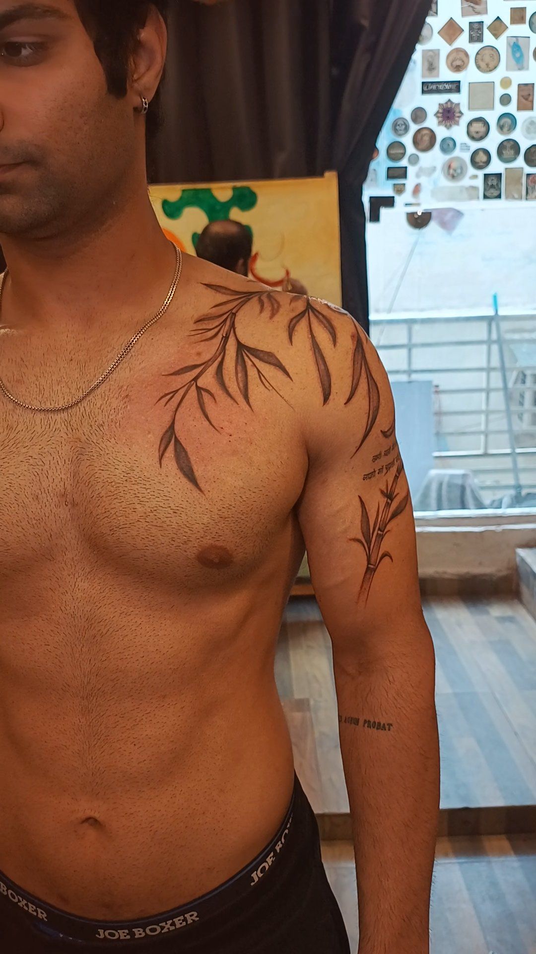 Fine line bamboo vines tattoo on arm