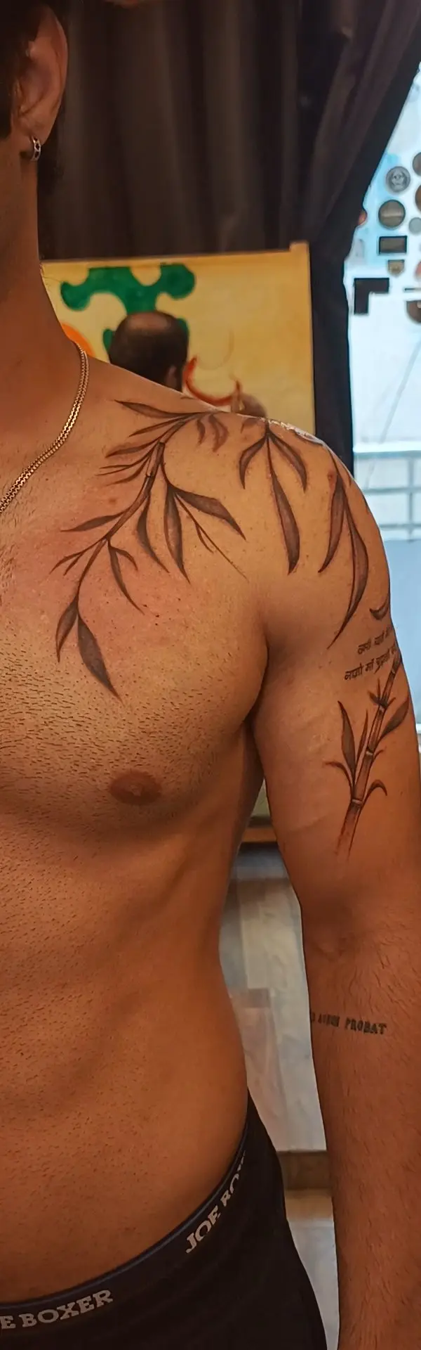 Fine line bamboo vines tattoo on arm