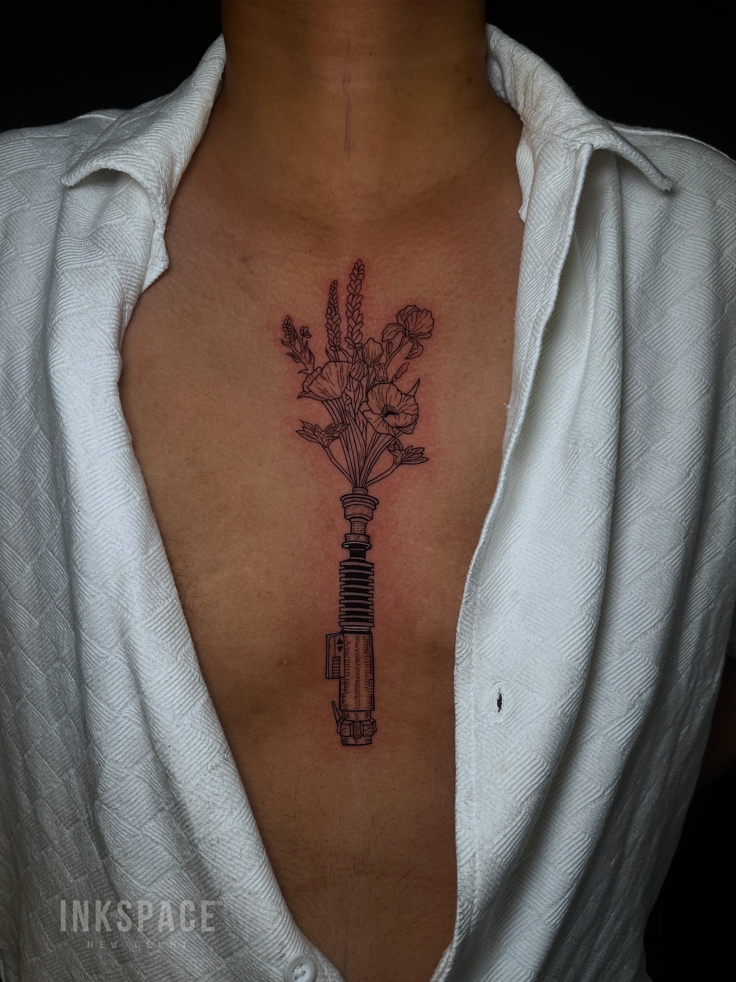 Fine line tattoo of Star Wars theme
