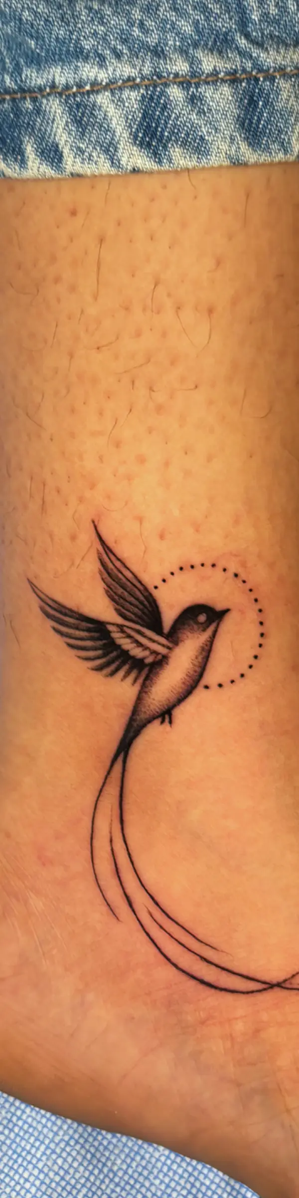 fine line tattoo depicting meaningful story elements