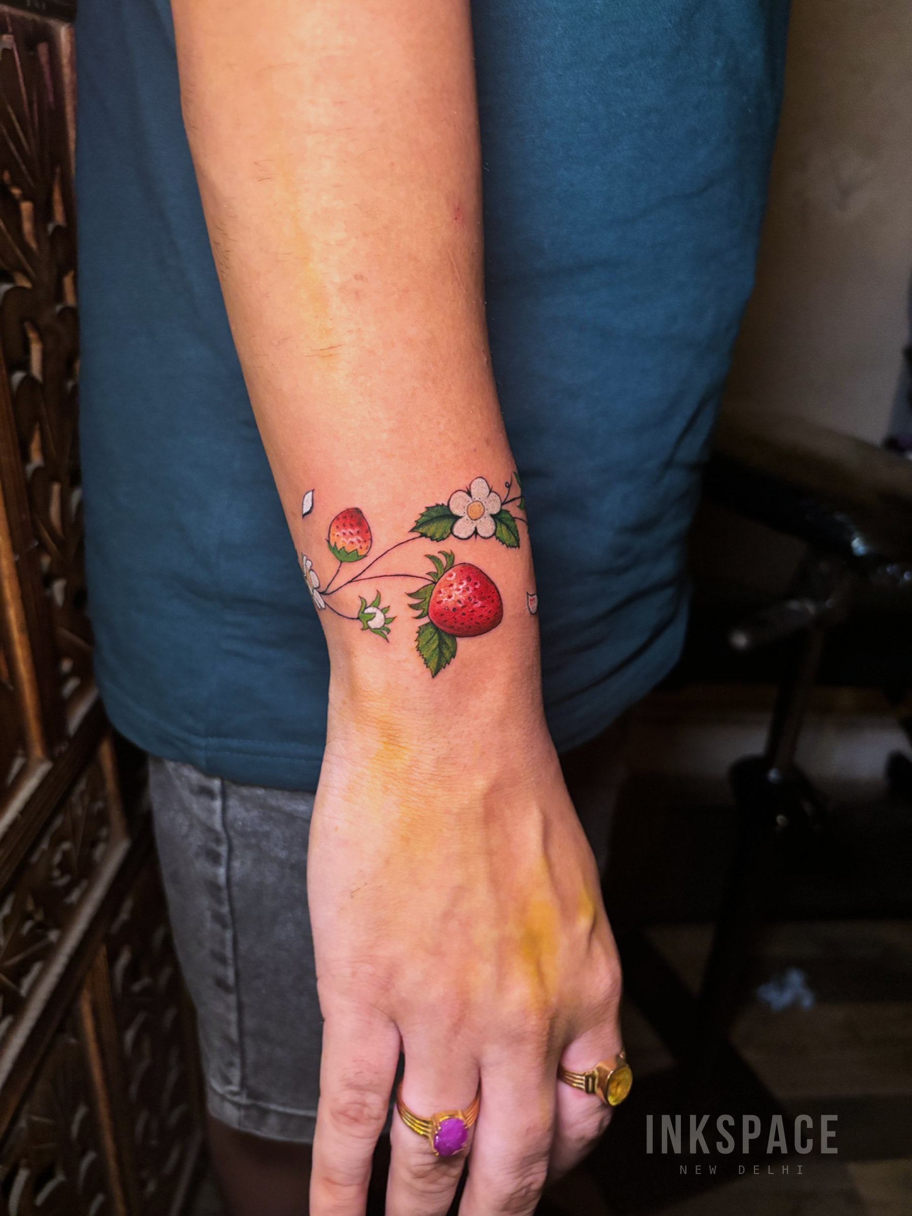 realism strawberry armband tattoo