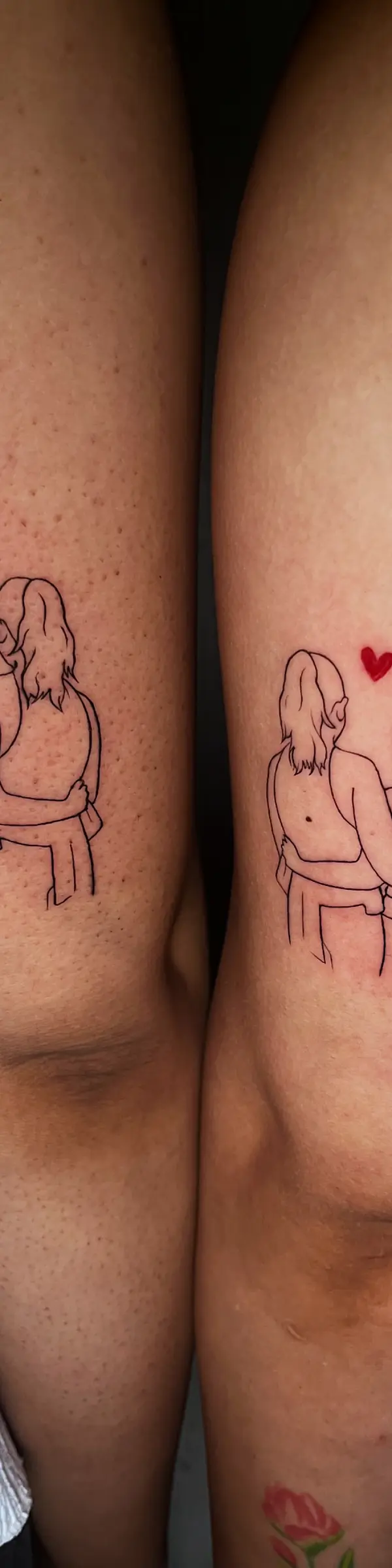 fine line matching sister tattoos