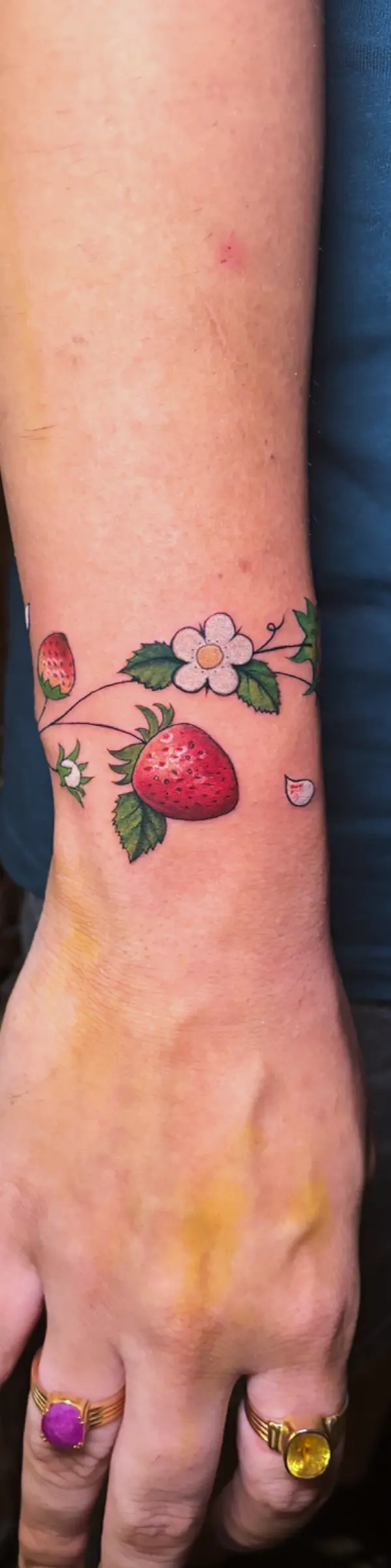 fine line strawberry botanical tattoo design