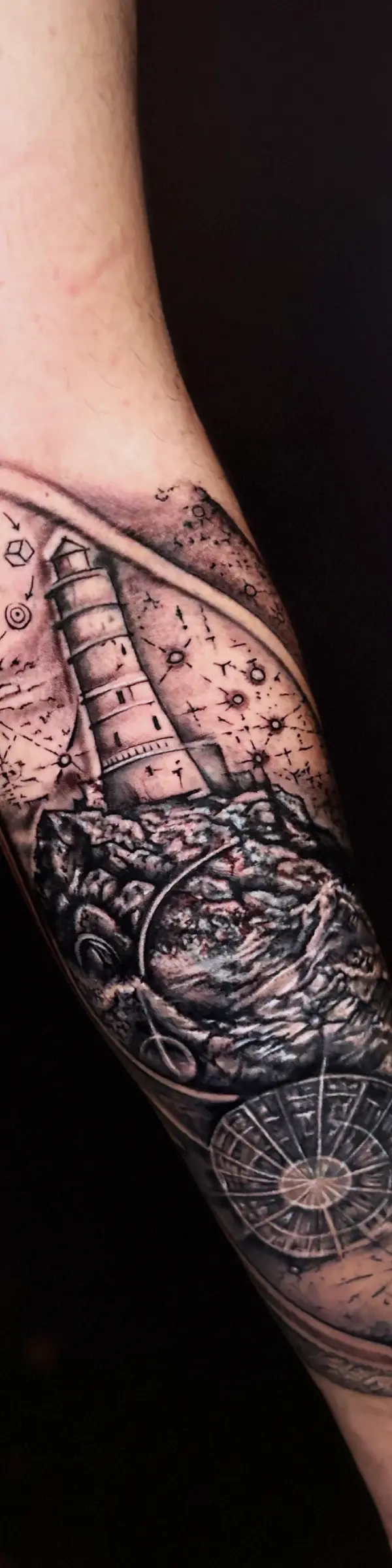realism lighthouse and compass tattoo sleeve