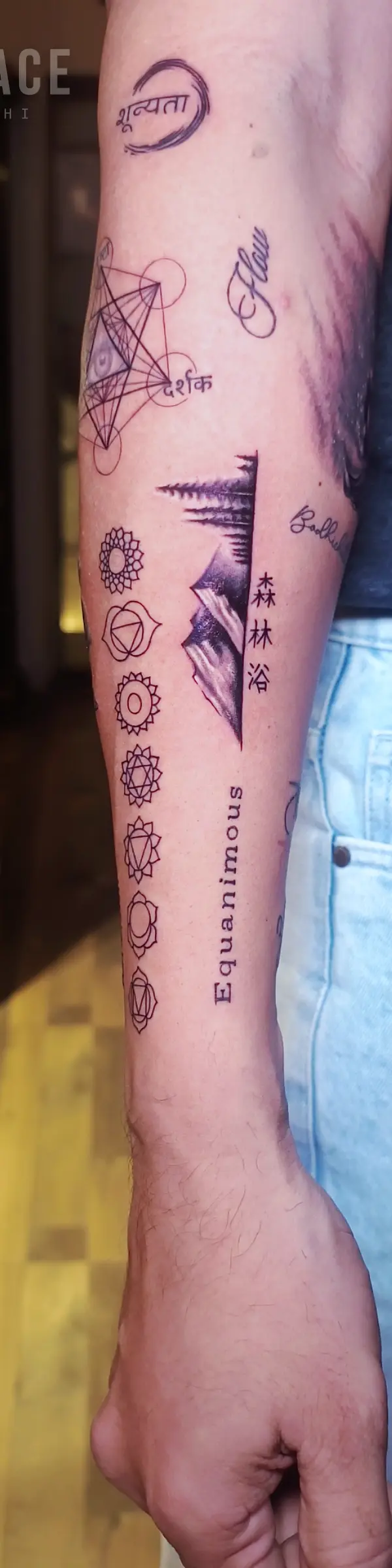 fine line sleeve tattoo showcasing personal symbols